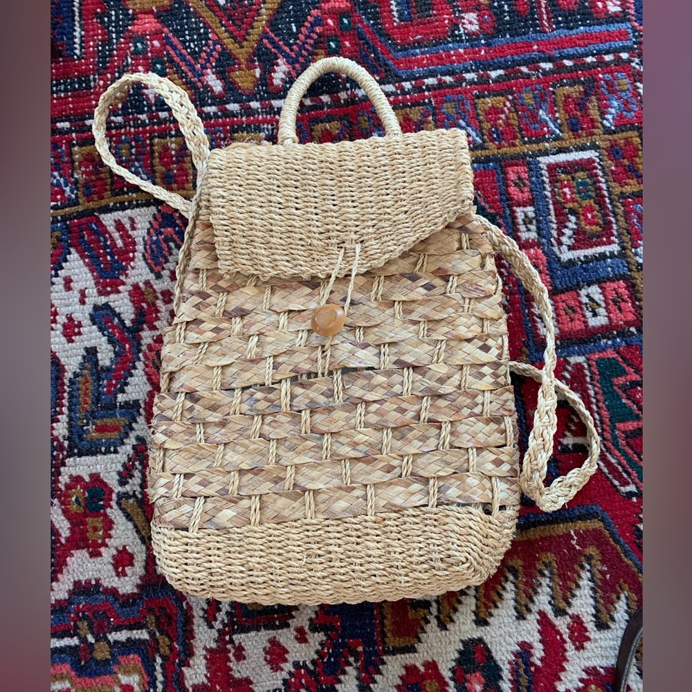 Pristine condition handwoven straw backpack made in Indonesia.